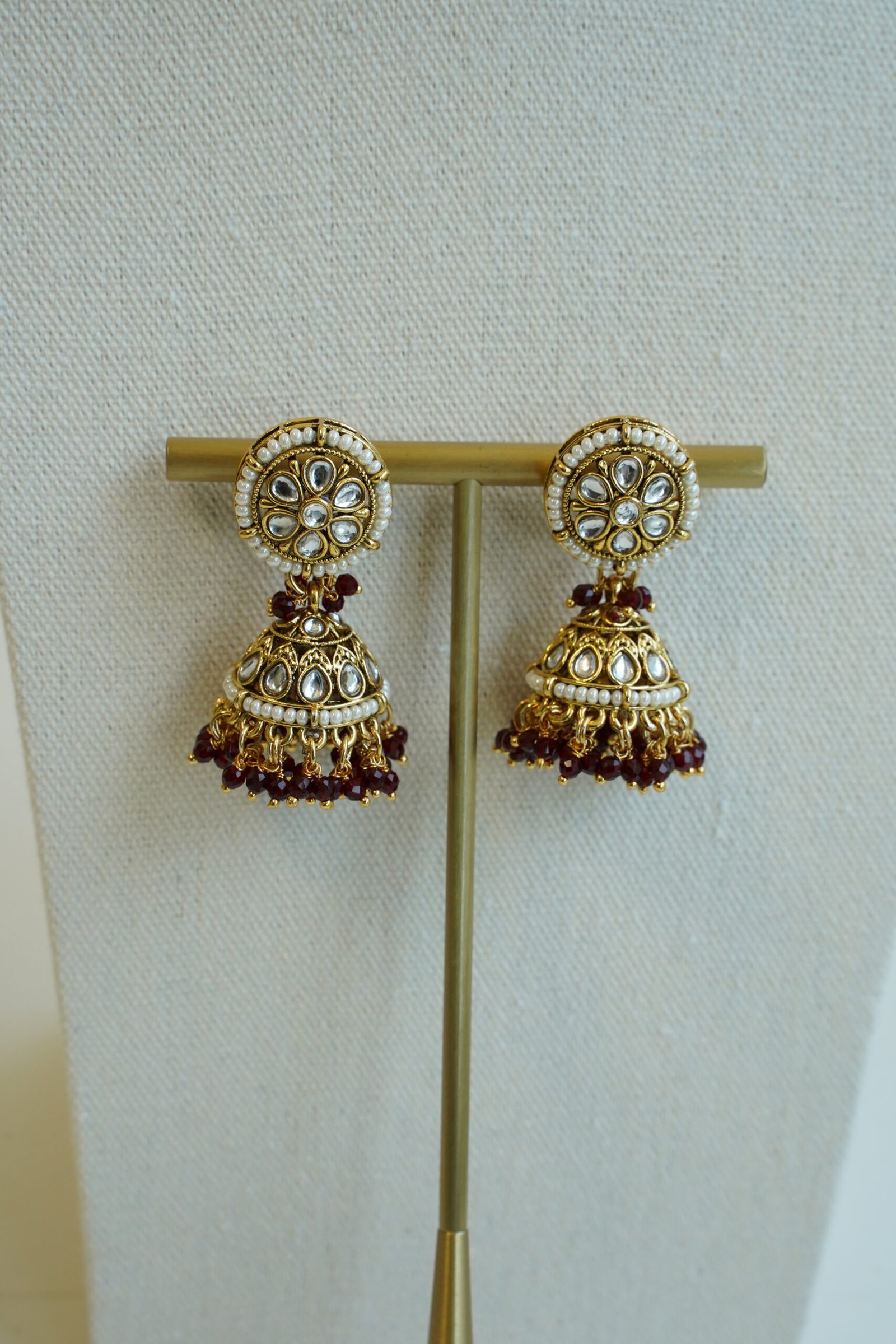 Riya artificial kundan necklace set in maroon with matching jhumka earrings and tikka, South Asian festive jewelry