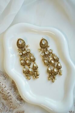 Slim kundan chandelier earrings with pearl accents, South Asian festive jewelry