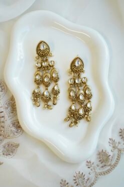 Slim kundan chandelier earrings with pearl accents, South Asian festive jewelry