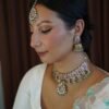 Amyra Choker Necklace Set - antique gold choker with pink stone work, mint accents, tikka, and jhumka earrings