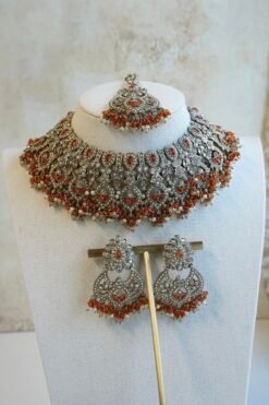 Antique champagne Anya necklace set in orange with matching earrings and maang tikka