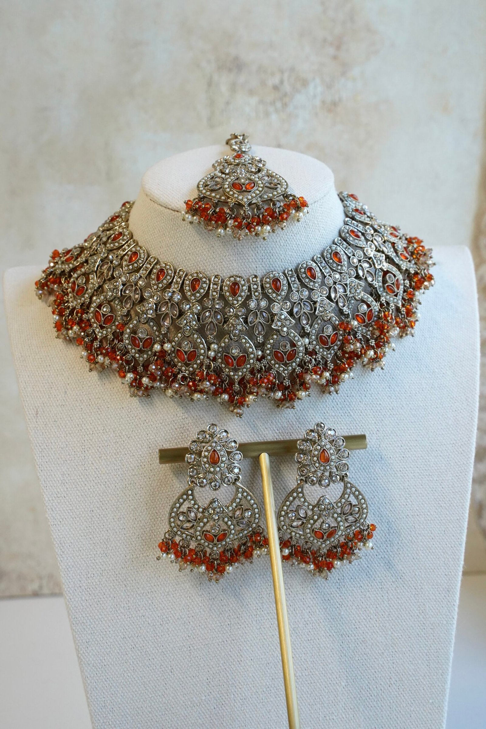 Antique champagne Anya necklace set in orange with matching earrings and maang tikka