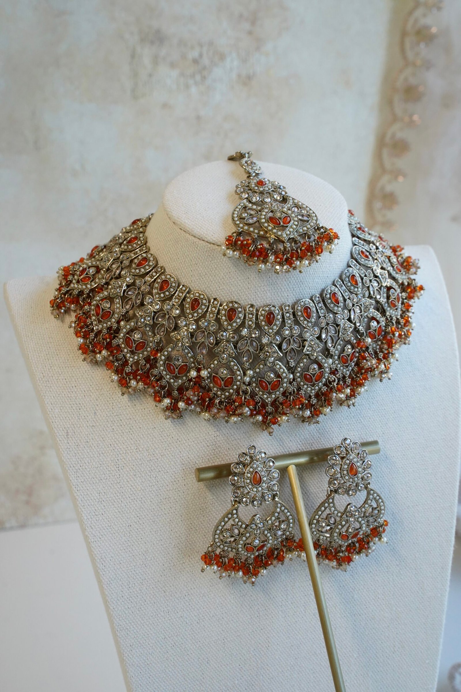 Antique champagne Anya necklace set in orange with matching earrings and maang tikka