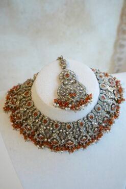Antique champagne Anya necklace set in orange with matching earrings and maang tikka