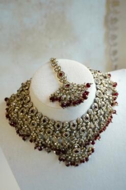 Maroon and antique champagne Arisha necklace set with matching earrings and maang tikka