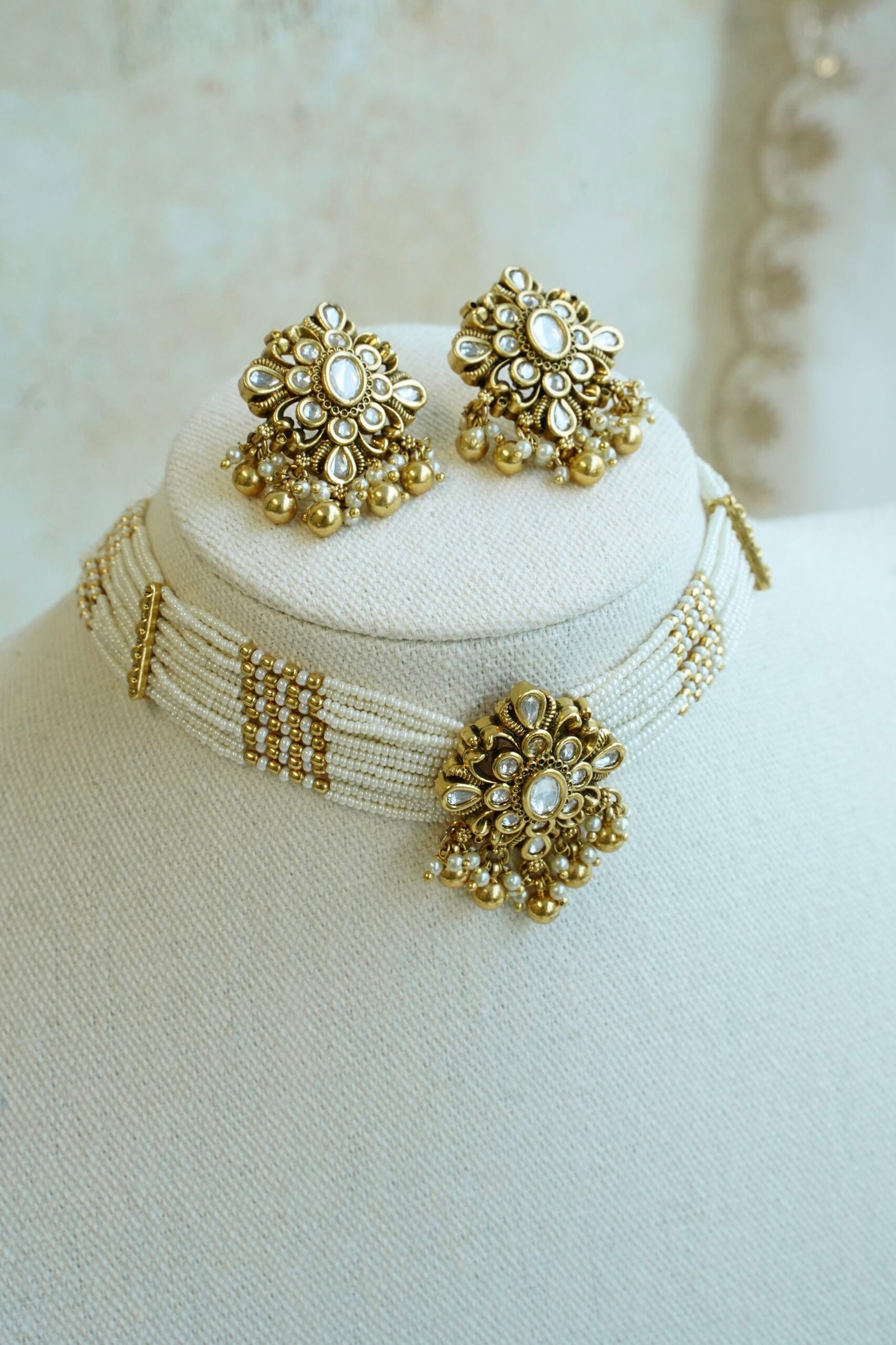 Floral Kundan Choker Set - floral kundan pendant on a multi-strand pearl choker with matching floral earrings