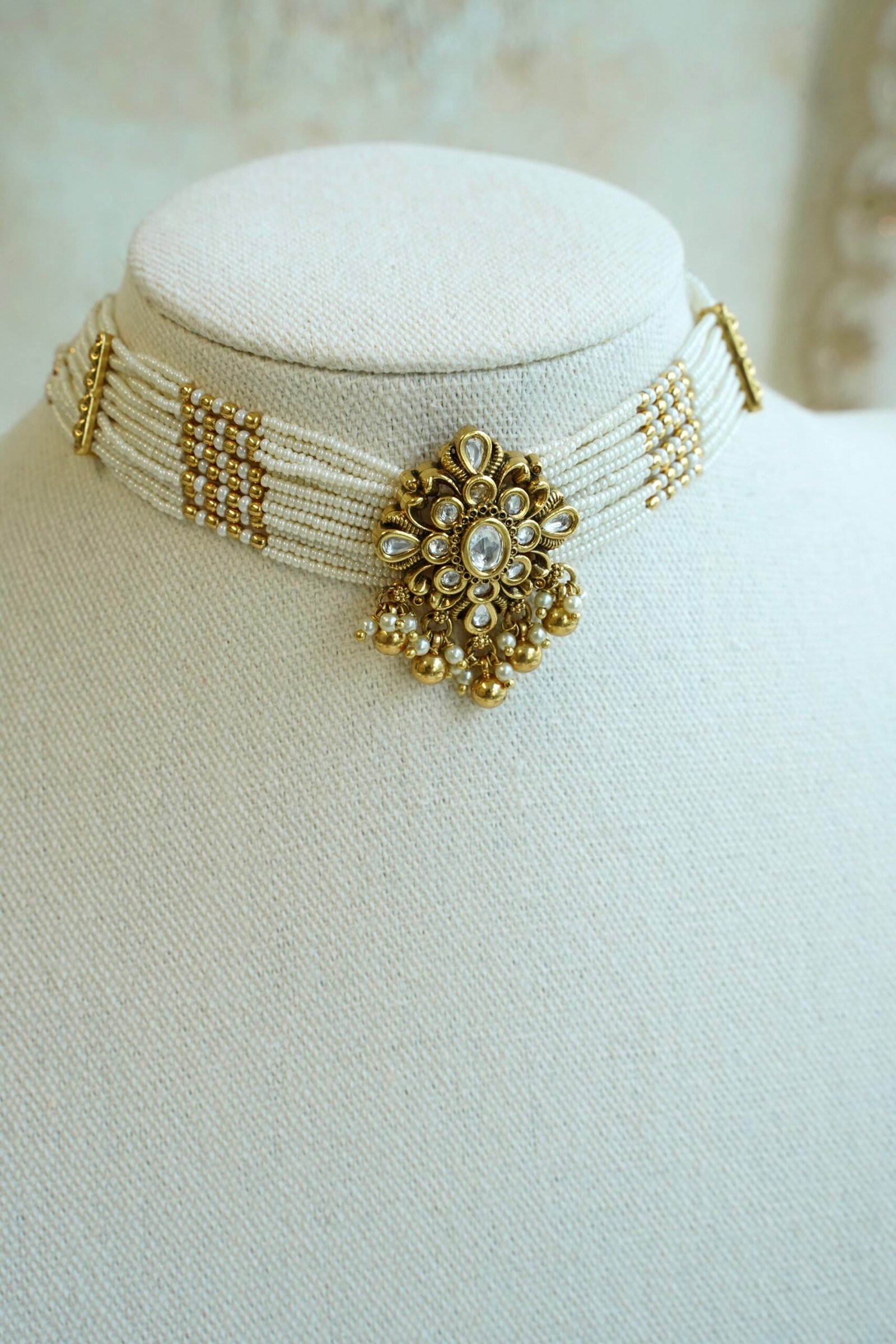 Floral Kundan Choker Set - floral kundan pendant on a multi-strand pearl choker with matching floral earrings
