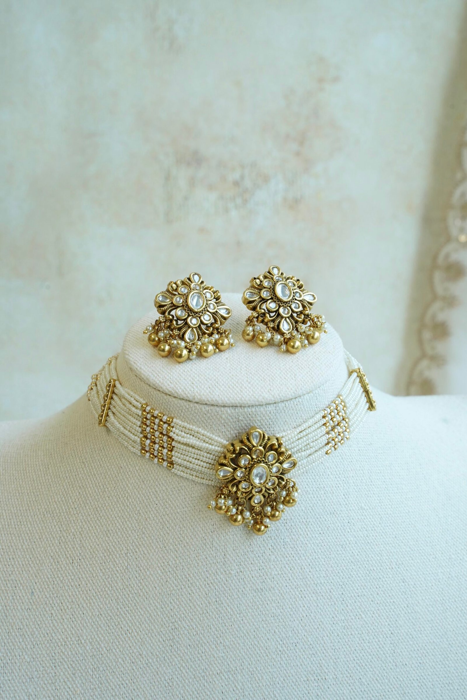 Floral Kundan Choker Set - floral kundan pendant on a multi-strand pearl choker with matching floral earrings