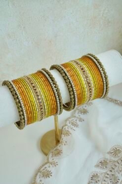 Golden Hour bangle set with gold ombre tones, stone detailing, and pearl trim