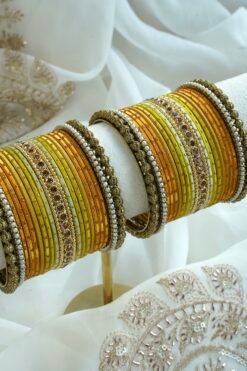Golden Hour bangle set with gold ombre tones, stone detailing, and pearl trim
