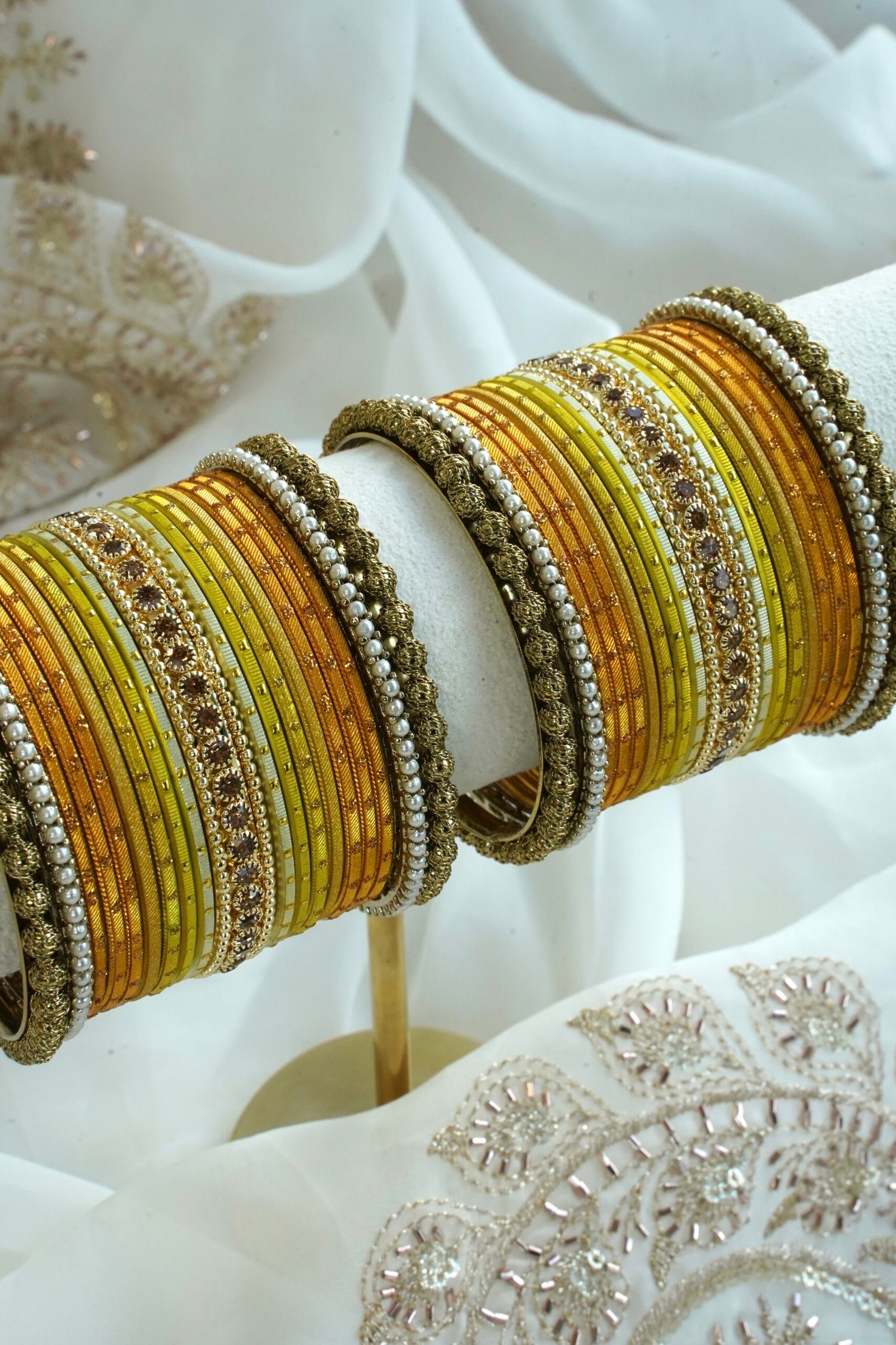 Golden Hour bangle set with gold ombre tones, stone detailing, and pearl trim