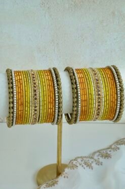 Golden Hour bangle set with gold ombre tones, stone detailing, and pearl trim