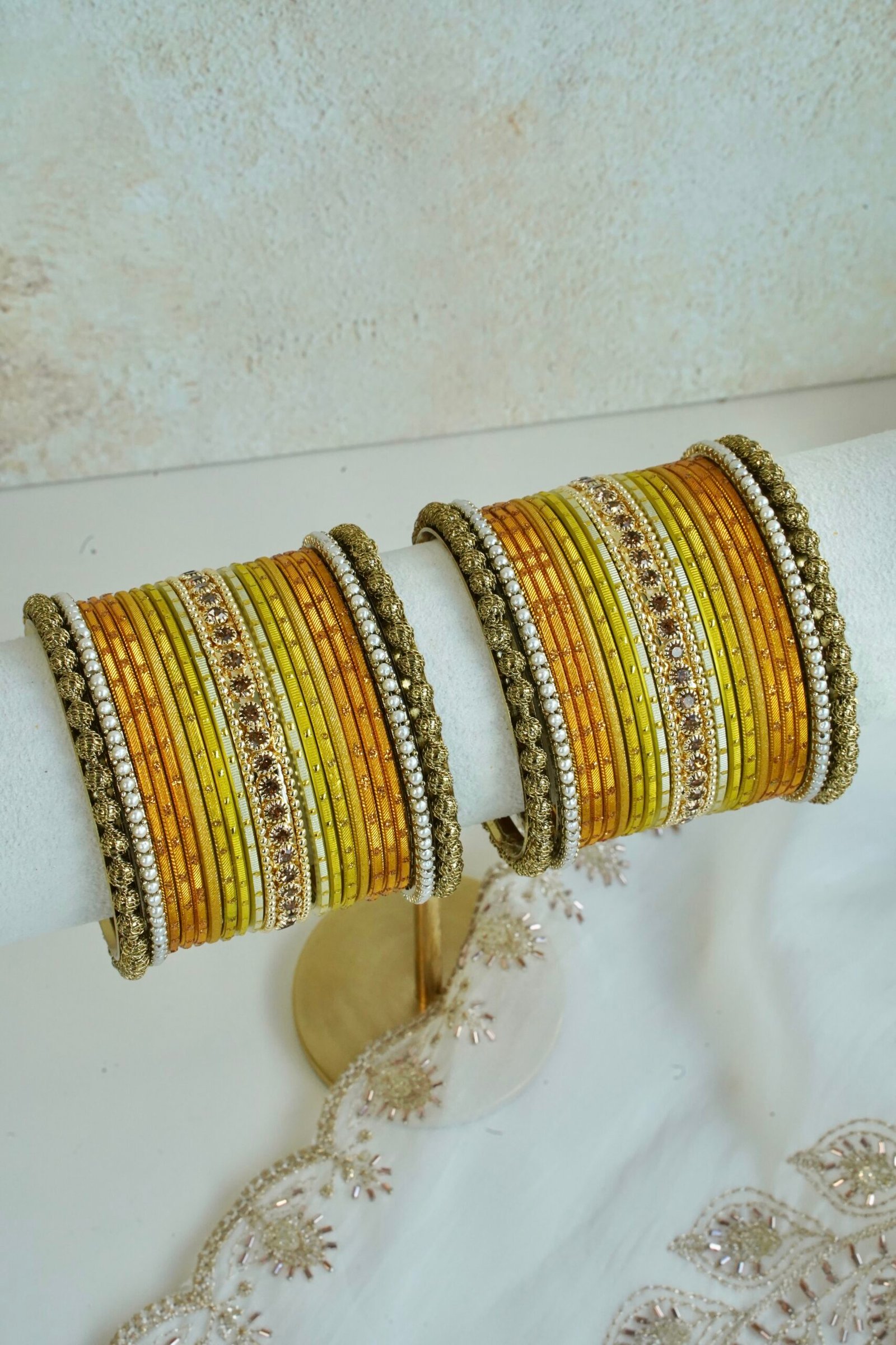 Golden Hour bangle set with gold ombre tones, stone detailing, and pearl trim