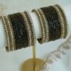 Black Glass bangle set with stone bands and antique gold-toned edging