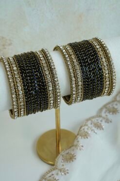 Black Glass bangle set with stone bands and antique gold-toned edging