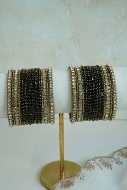 Black Glass bangle set with stone bands and antique gold-toned edging
