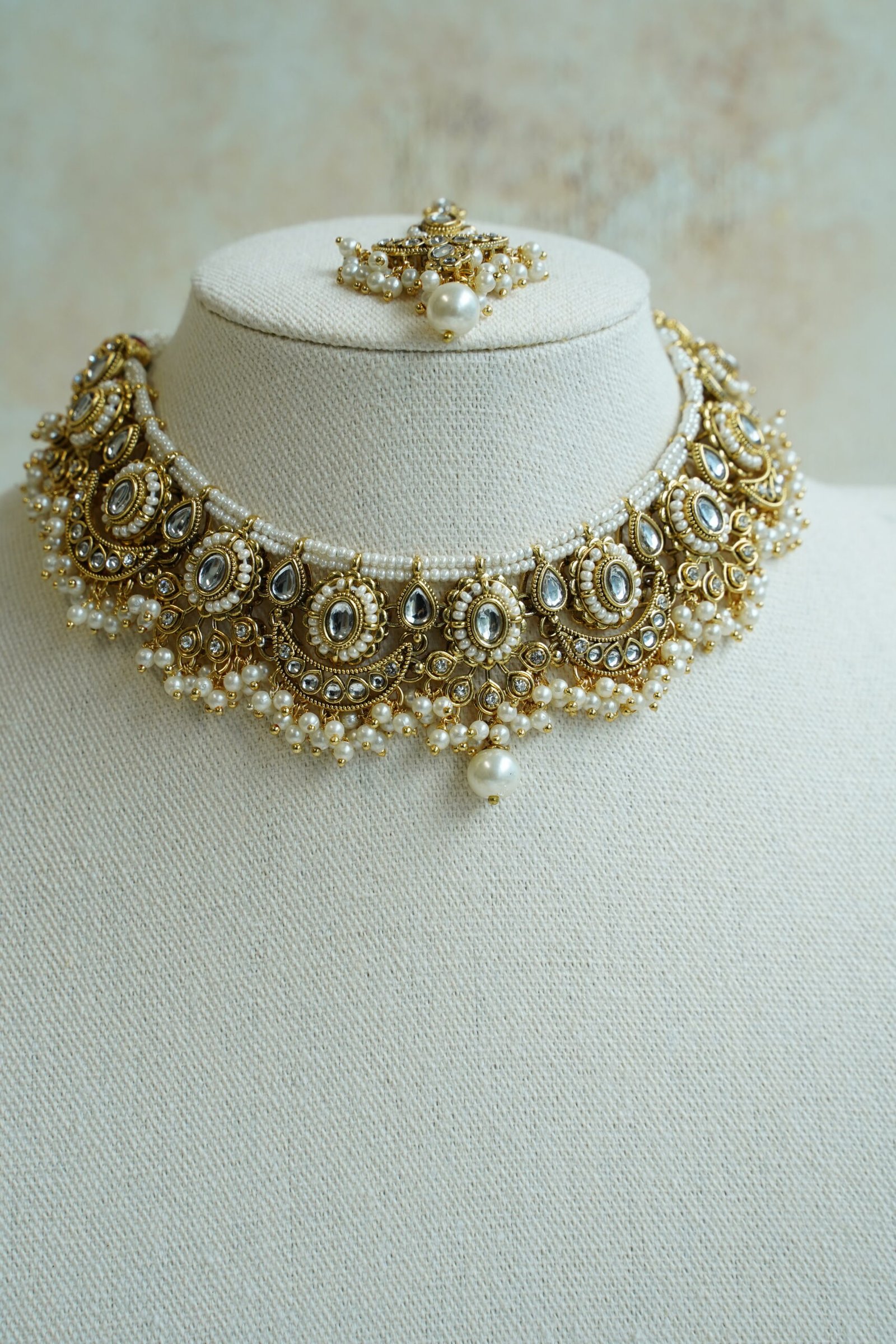 Mahnoor artificial kundan bridal set with choker necklace, jhumka earrings, and tikka