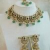 Mahnoor ruby and green artificial kundan jewelry set with choker necklace, jhumka earrings, and tikka