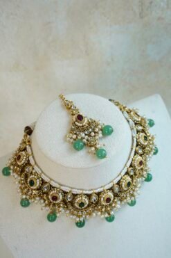Mahnoor ruby and green artificial kundan jewelry set with choker necklace, jhumka earrings, and tikka