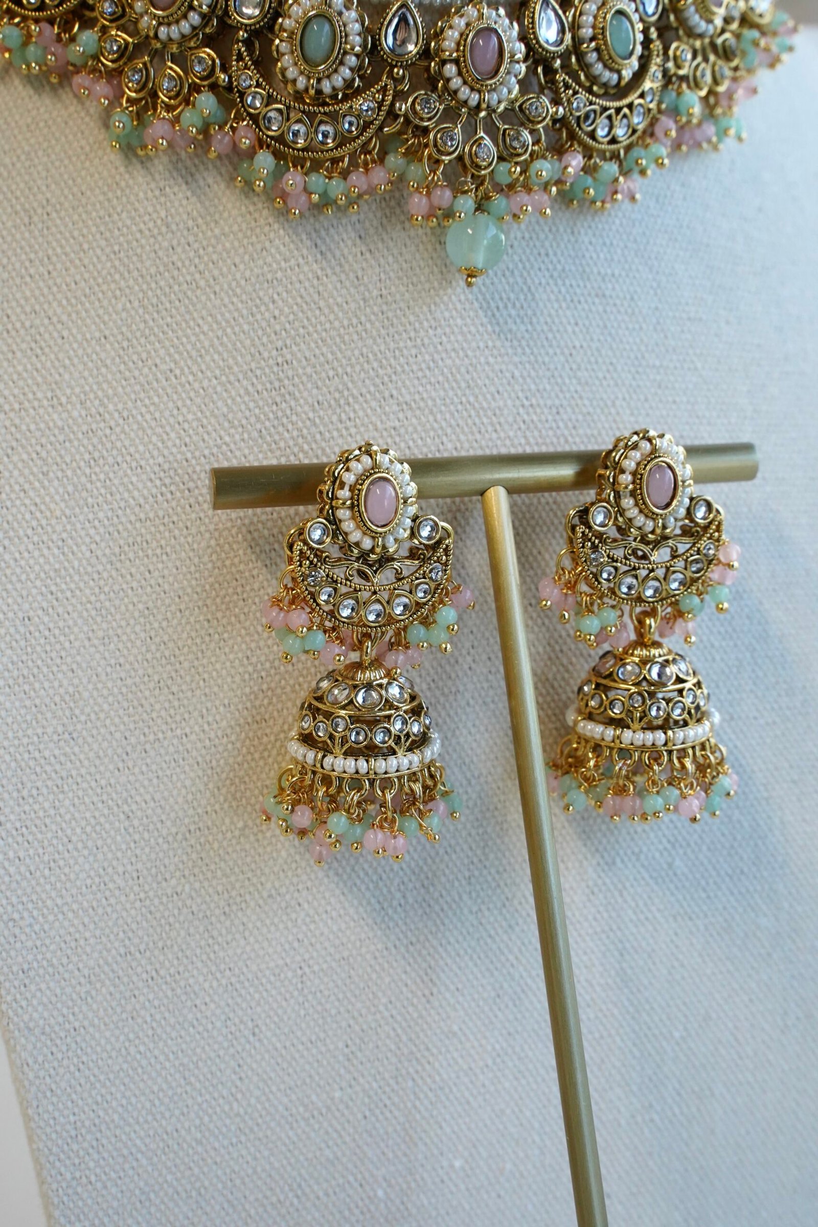 Pastel pink and mint Mahnoor kundan necklace set with jhumka earrings and tikka