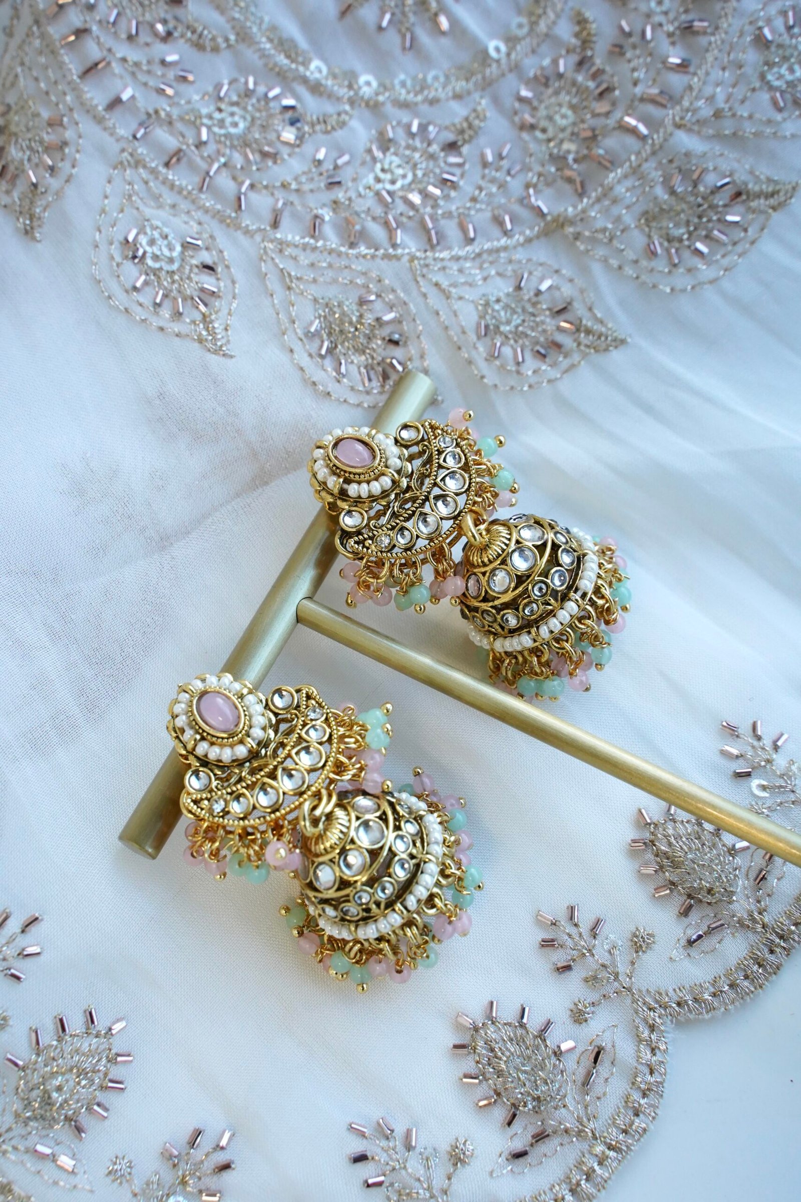 Pastel pink and mint Mahnoor kundan necklace set with jhumka earrings and tikka