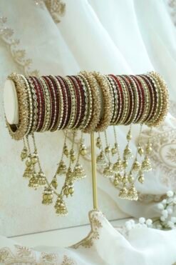 Maroon and antique gold connected bridal bangle set with hanging jhumka charms