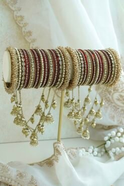 Maroon and antique gold connected bridal bangle set with hanging jhumka charms