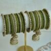 Mehndi Jhumka bangle set with olive green tones, stone bands, and dangling jhumka charm