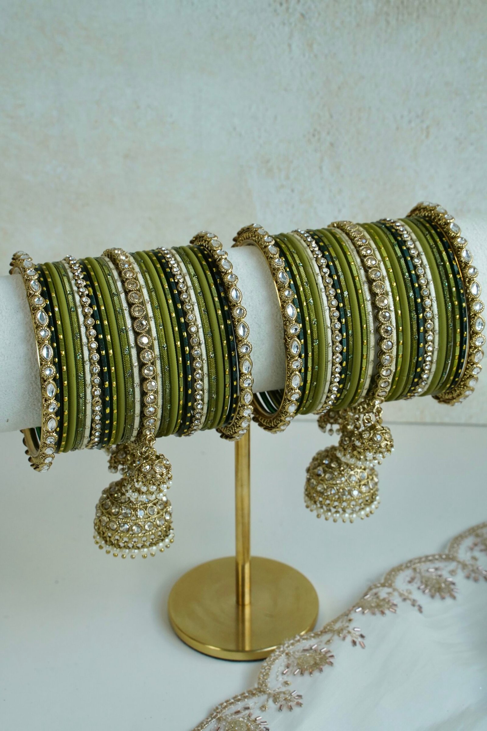 Mehndi Jhumka bangle set with olive green tones, stone bands, and dangling jhumka charm