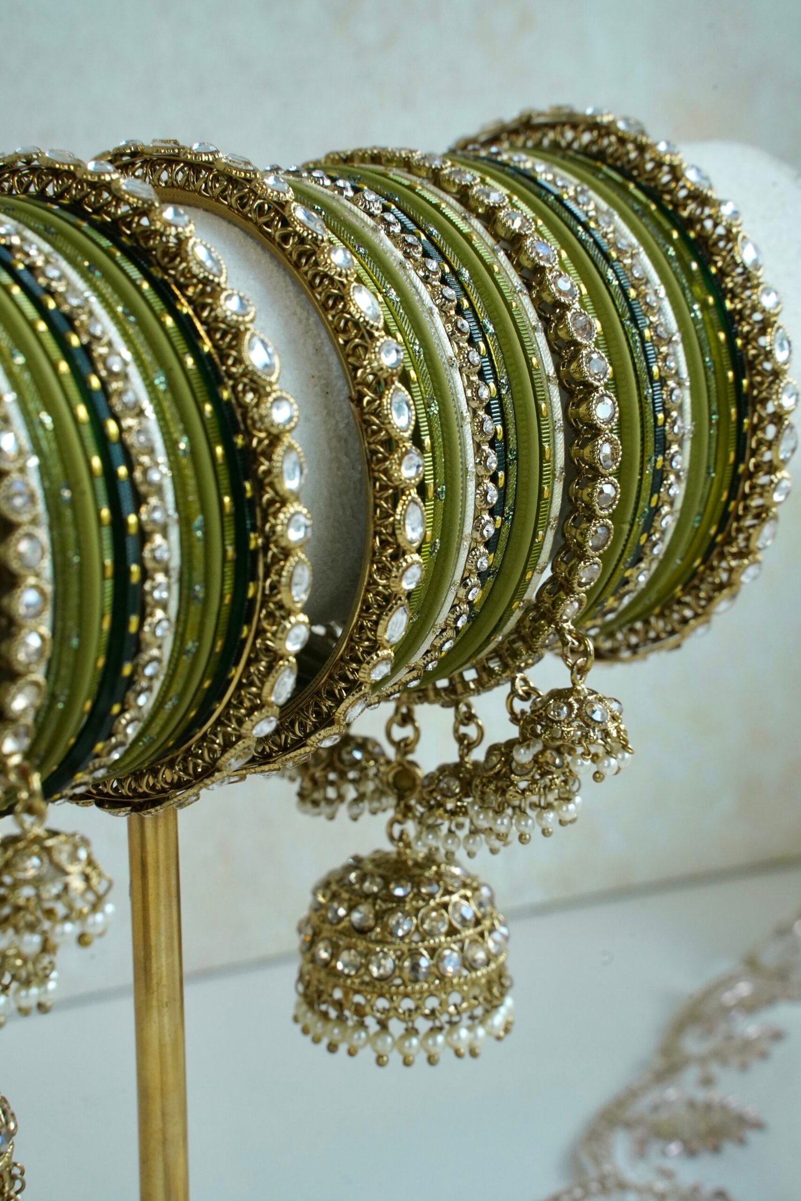 Mehndi Jhumka bangle set with olive green tones, stone bands, and dangling jhumka charm