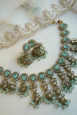 Mint Vine Necklace Set - antique gold necklace with mint stone clusters, pearl bead drops, jhumka earrings, and tikka