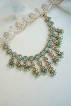 Mint Vine Necklace Set - antique gold necklace with mint stone clusters, pearl bead drops, jhumka earrings, and tikka