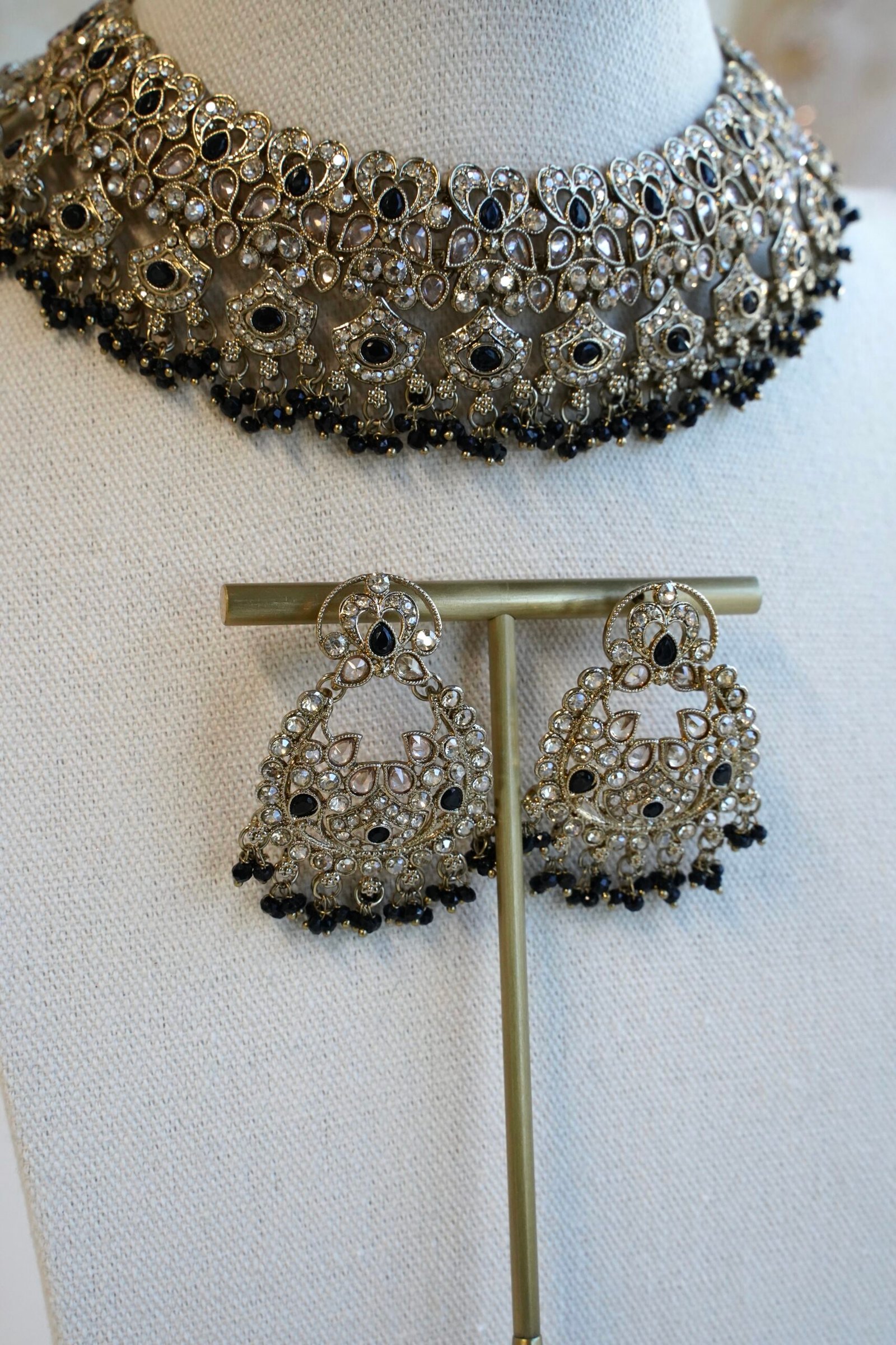 Antique gold Moni black necklace set with black stone accents and bead fringe