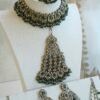 Champagne and green Nazneen bridal set with jhumar, earrings, nath, and tikka