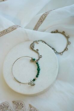 Champagne and green Nazneen bridal set with jhumar, earrings, nath, and tikka