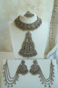 Light pink and champagne gold Nazneen bridal set with jhumar, earrings, nath, and tikka