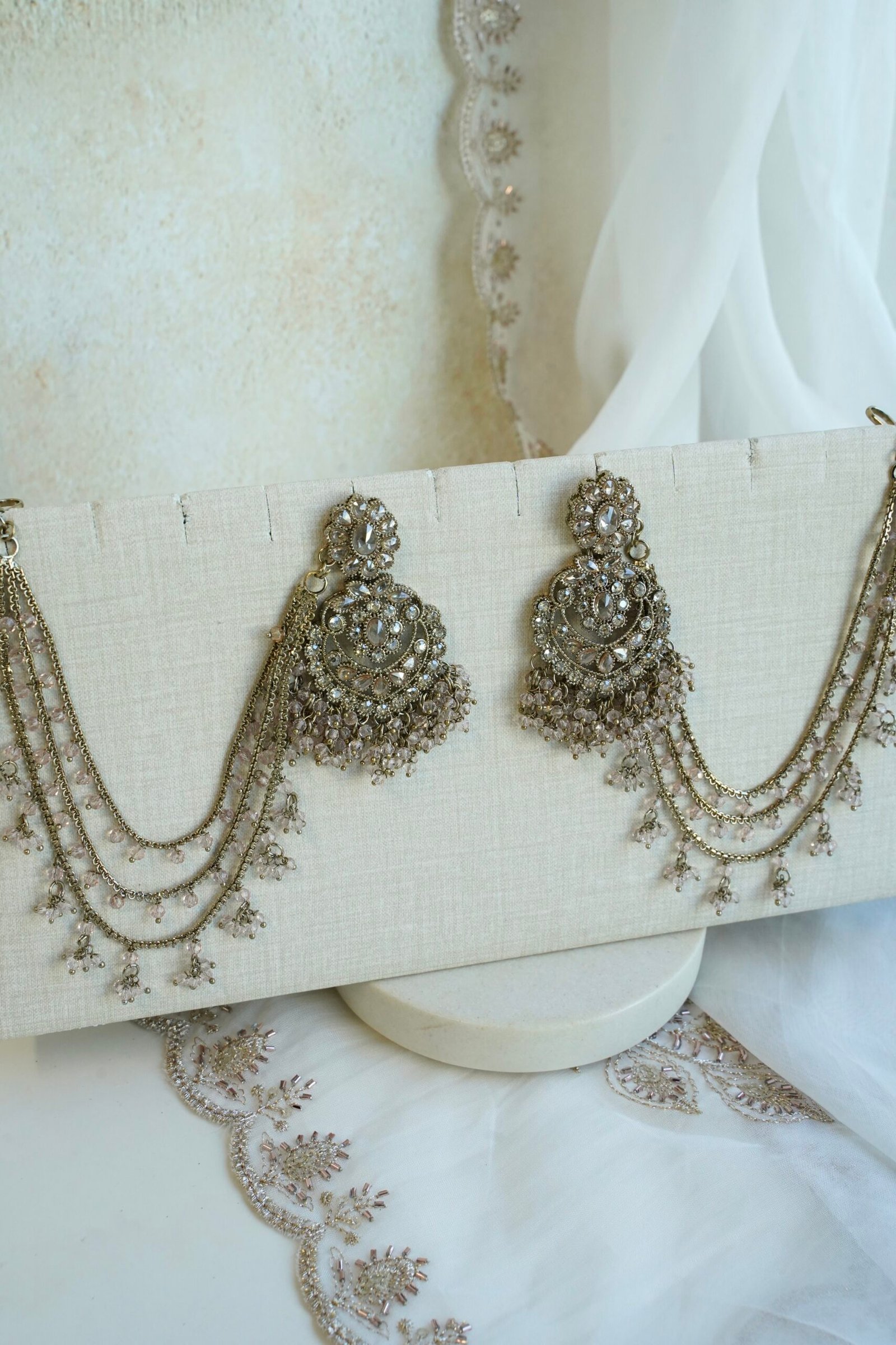 Light pink and champagne gold Nazneen bridal set with jhumar, earrings, nath, and tikka
