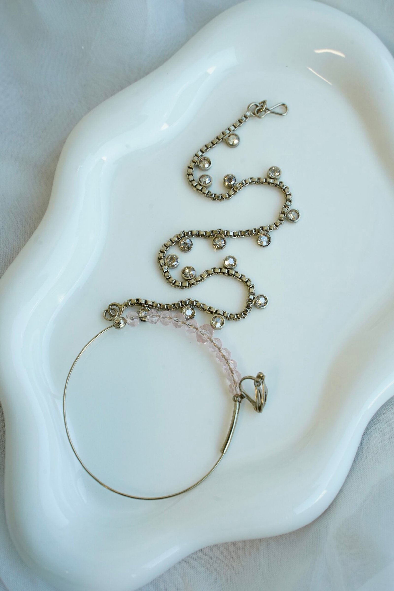 Light pink and champagne gold Nazneen bridal set with jhumar, earrings, nath, and tikka