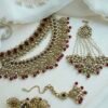 Zeenat Maroon Bridal Set - antique gold kundan bridal jewelry set with layered choker necklace, jhumar, jhumka earrings, and tikka