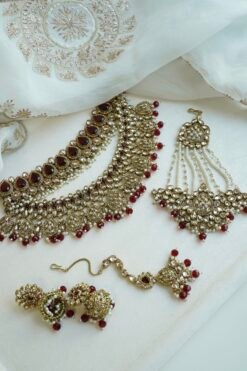 Zeenat Maroon Bridal Set - antique gold kundan bridal jewelry set with layered choker necklace, jhumar, jhumka earrings, and tikka