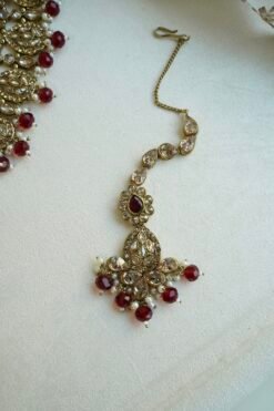 Zeenat Maroon Bridal Set - antique gold kundan bridal jewelry set with layered choker necklace, jhumar, jhumka earrings, and tikka