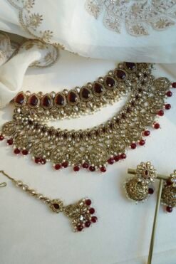 Zeenat Maroon Bridal Set - antique gold kundan bridal jewelry set with layered choker necklace, jhumar, jhumka earrings, and tikka