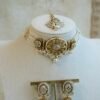 Aaliyah antique gold kundan choker set with pearl beaded band, jhumka earrings, and tikka