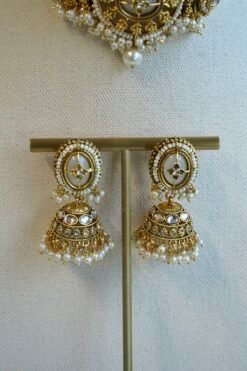 Aaliyah antique gold kundan choker set with pearl beaded band, jhumka earrings, and tikka
