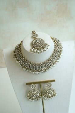 Alaya white zircon necklace set with beaded drops, earrings, and tikka in antique gold tone