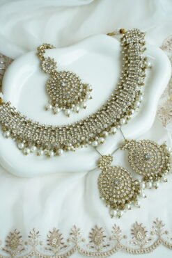 Alaya white zircon necklace set with beaded drops, earrings, and tikka in antique gold tone