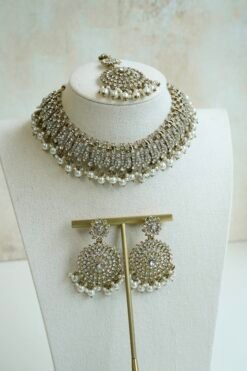 Alaya white zircon necklace set with beaded drops, earrings, and tikka in antique gold tone