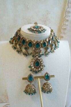 Amyra teal choker necklace set with pendant drop, tikka, and jhumka earrings in antique gold tone