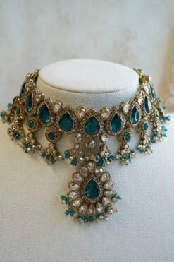 Amyra teal choker necklace set with pendant drop, tikka, and jhumka earrings in antique gold tone