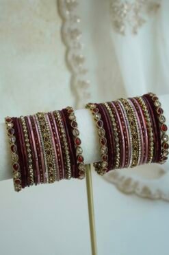 Hina maroon, wine, and dusty pink velvet stacked bangle set with red and champagne stone bangles in antique gold tone
